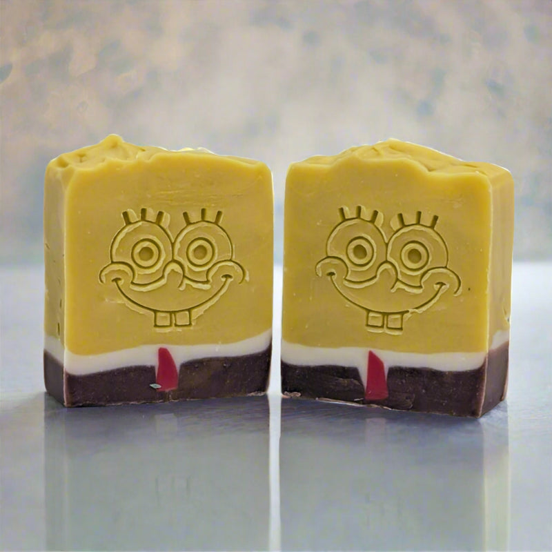 He smells like pineapple because he lives in one! A fun soap bar for all ages, inspired by the lovable Spongebob Squarepants character. Made with 25% shea butter providing a nourishing and hydrating bath experience.