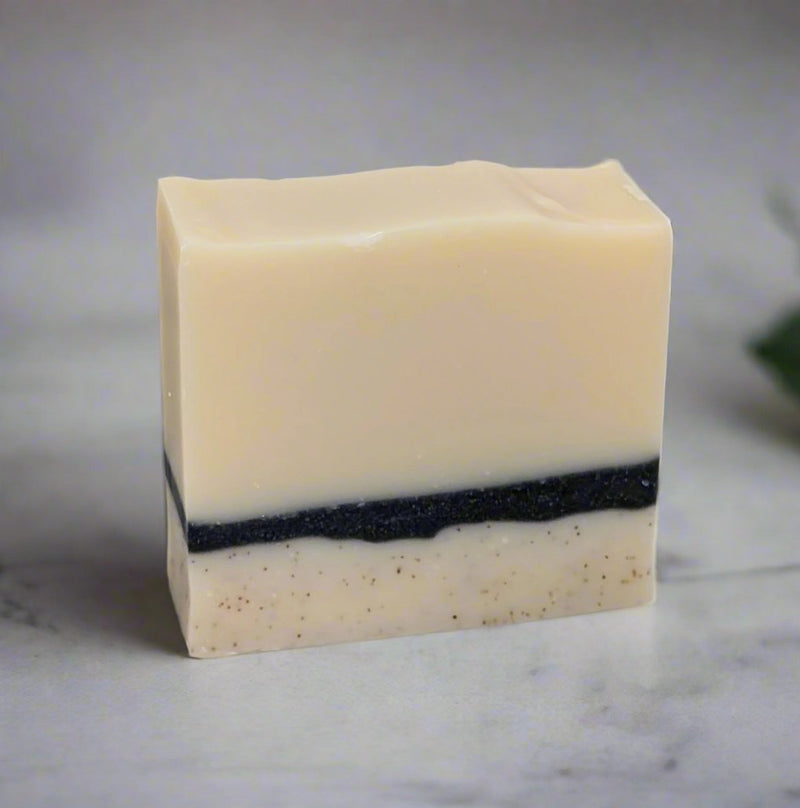 Made with 25% shea butter, this all natural soap bar has apricot kernel shells in the bottom layer for exfoliation, a middle layer with charcoal, and is scented with tea tree and lemon essential oils. These ingredients work together to provide a moisture-rich and rejuvenating skin cleansing experience, complemented by a luscious creamy lather.